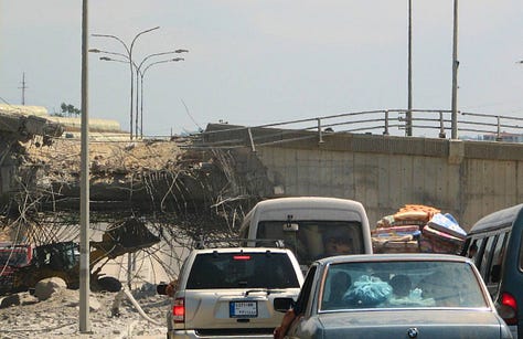 Dr. Mohammad Osman's office, shattered windows. Traffic heading south. Bombed bridges. Mattresses on cars. Photos by Constantine Markides