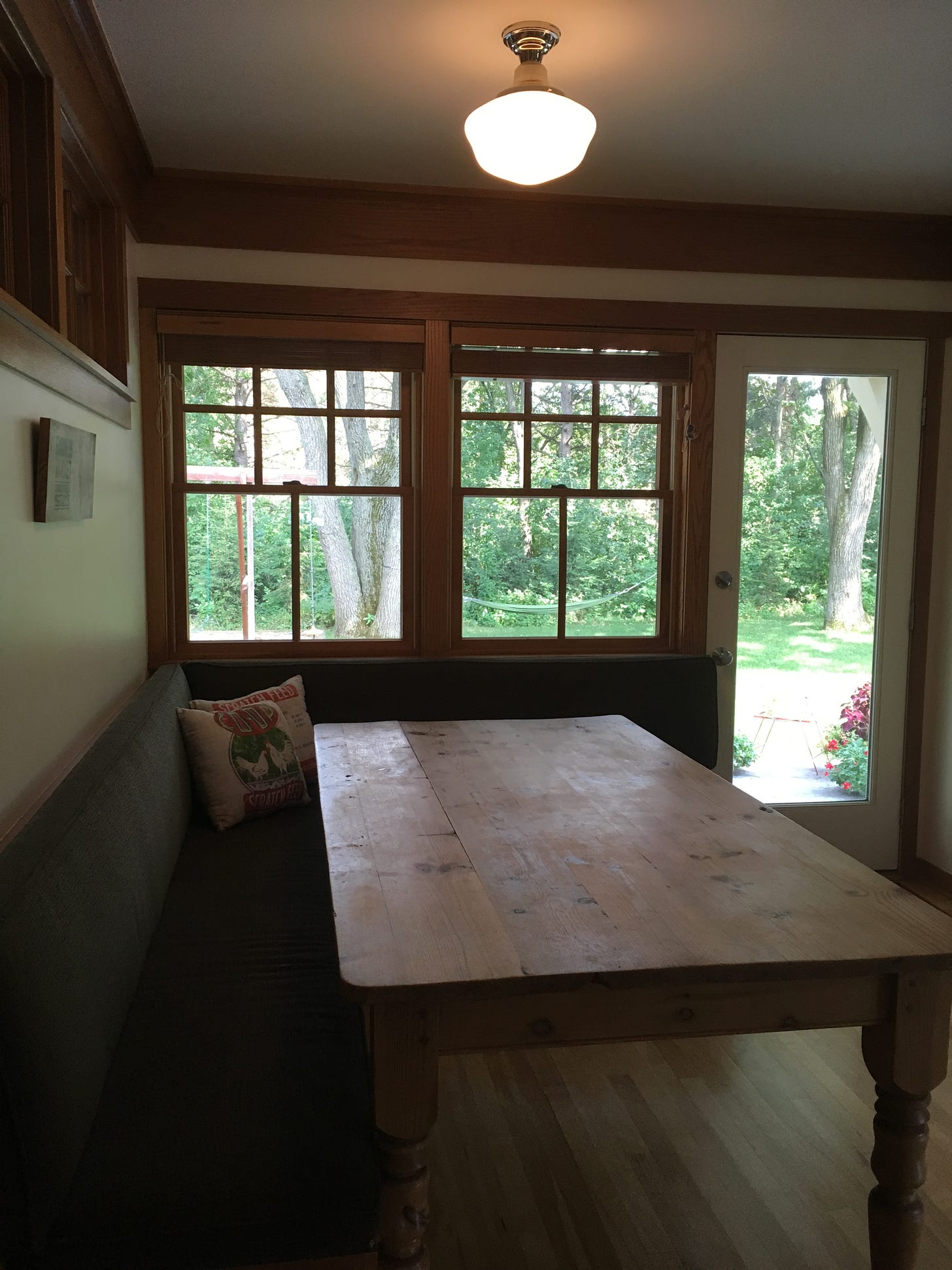 Farmhouse table in breakfast nook. Farmhouse table in breakfast nook.