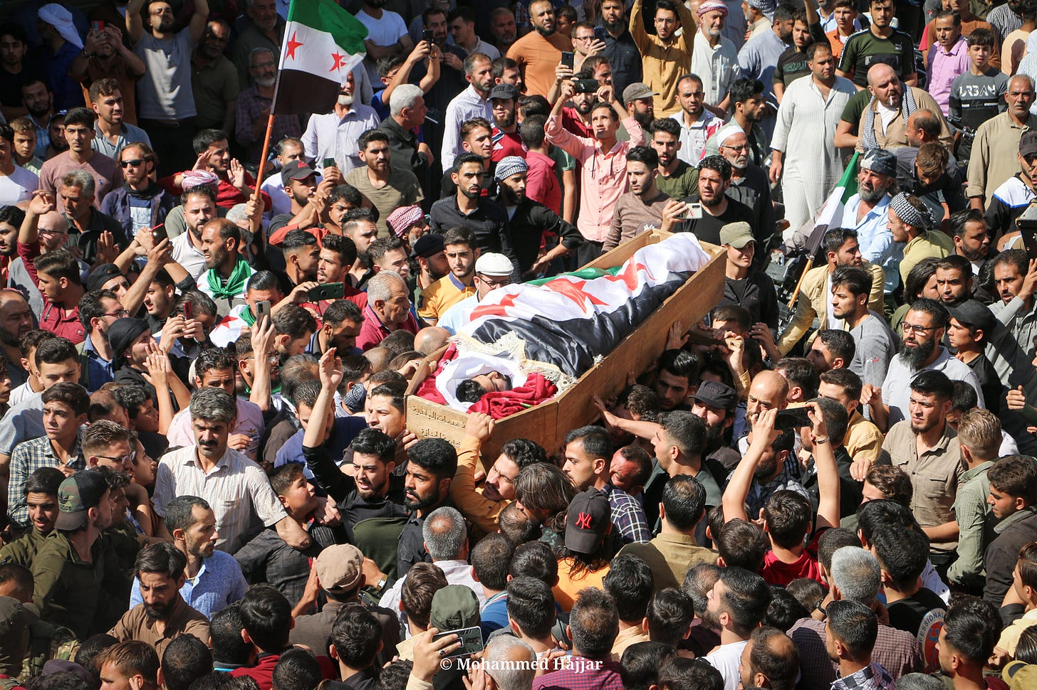 May be an image of one or more people, people standing, outdoors, crowd and text that says 'Mohammed Hajjar' May be an image of one or more people, people standing, outdoors, crowd and text that says 'Mohammed Hajjar'