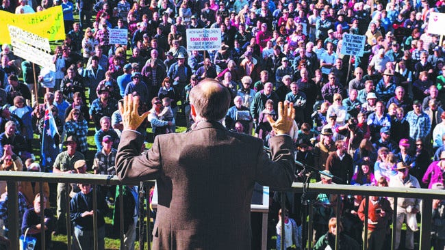r/pics - Then-Australian PM John Howard wears a bullet proof vest as he campaigns for gun control at a pro-gun rally