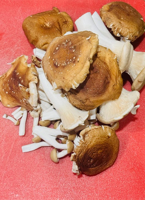 Mushrooms on a cutting board: king oyster, brown beech, and shiitake. A bouquet garni of thyme, dill, sage, and parsley tied together with kitchen twine. Flour being added to softened mushrooms, leeks, and celery in a stock pot for Irish wild mushroom soup.