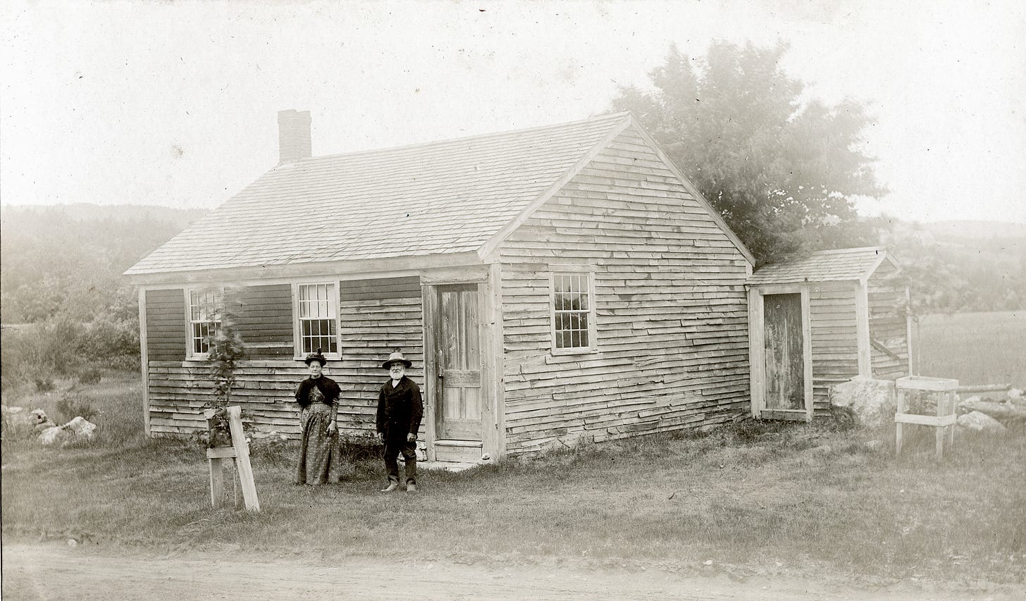 Man and woman and small house