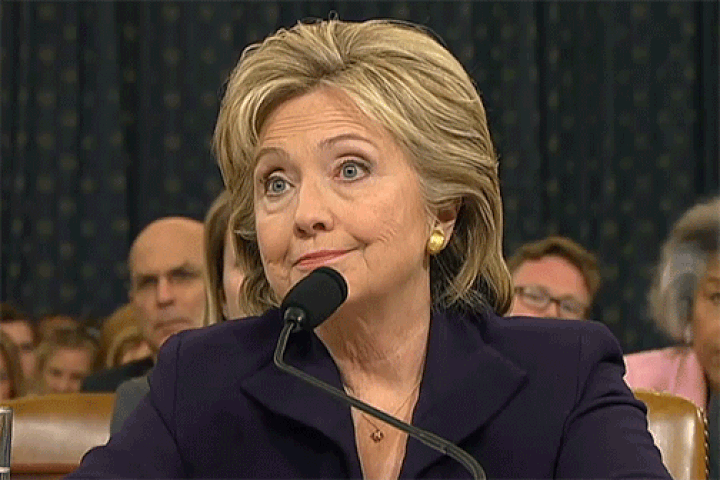 Gif image of Hillary Clinton laughing in response to a question during the Benghazi hearings. 