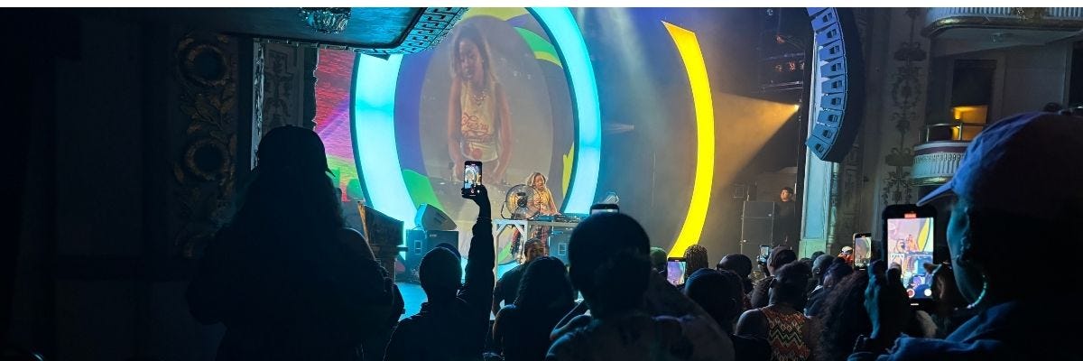 Fan enjoying Uncle Waffles live at The Apollo Theater