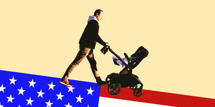 Father pushing a stroller down an American Flag Hill.