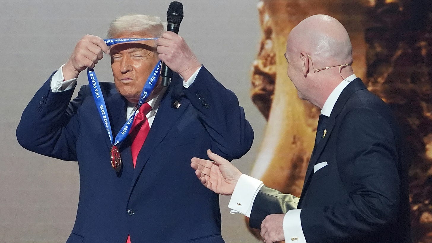 President Donald Trump is presented with the inaugural FIFA Peace Prize by FIFA President Gianni Infantino during the 2026 FIFA World Cup draw at the Kennedy Center, Friday, Dec. 5, 2025, in Washington. President Donald Trump is presented with the inaugural FIFA Peace Prize by FIFA President Gianni Infantino during the 2026 FIFA World Cup draw at the Kennedy Center, Friday, Dec. 5, 2025, in Washington.
