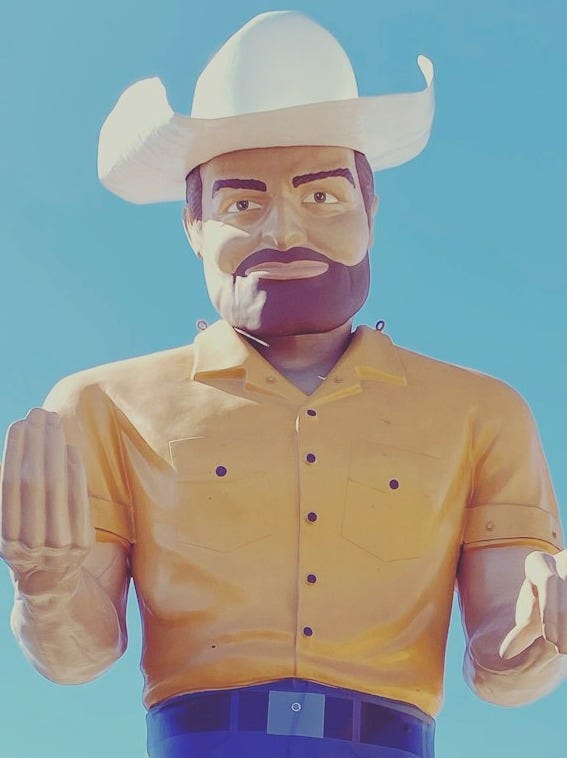 man in yellow dress shirt wearing white cowboy hat man in yellow dress shirt wearing white cowboy hat