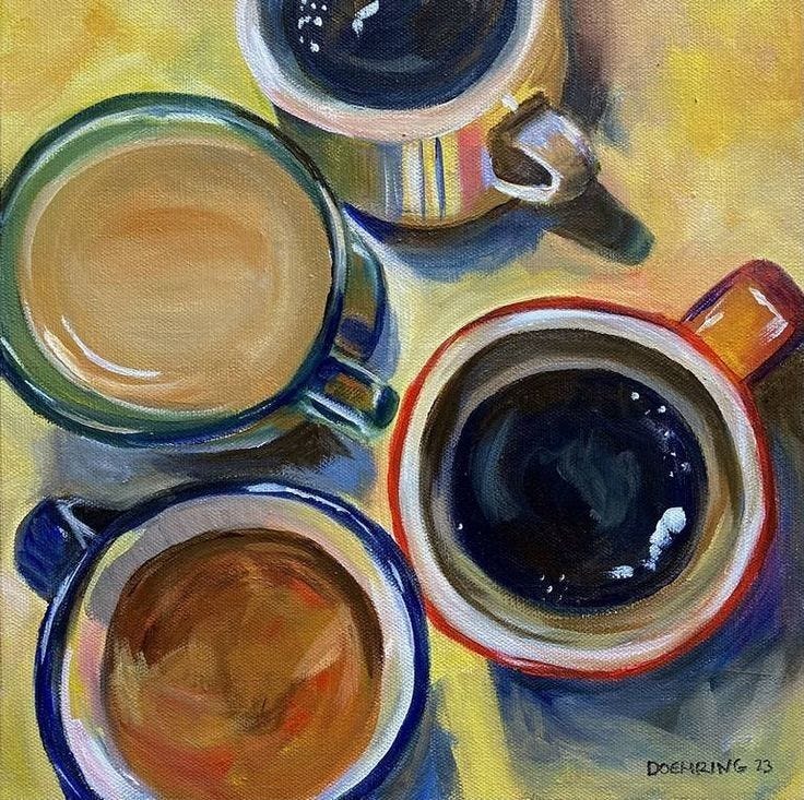 This may contain: three cups of coffee are sitting on a yellow tablecloth, one is blue and the other is brown
