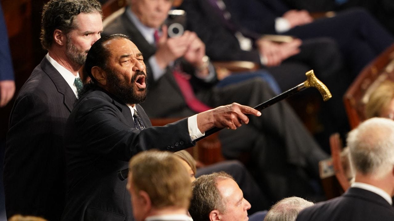 US Representative Al Green (D-TX) (L) disrupts US President Donald Trump  as he addressed to a joint session of Congress at the US Capitol in Washington, DC, on March 4, 2025. (Photo by ALLISON ROBBERT / AFP) (Photo by ALLISON ROBBERT/AFP via Getty Images)          