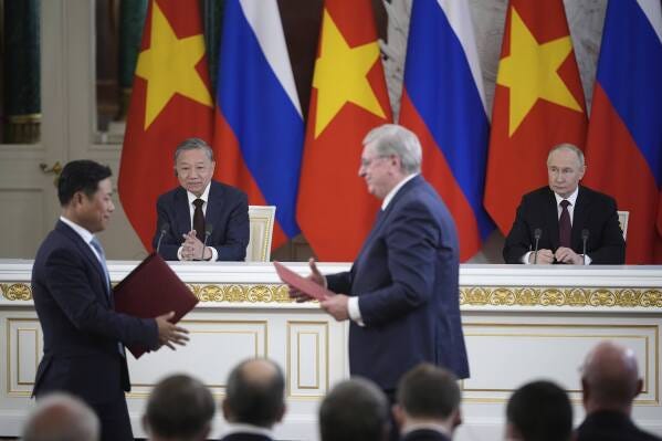 FILE- Russian President Vladimir Putin, right, and General Secretary of the Central Committee of the Communist Party of Vietnam To Lam attend a signing ceremony following their talks at the Kremlin in Moscow, Russia, on Saturday, May 10, 2025. (AP Photo/Pavel Bednyakov, File)