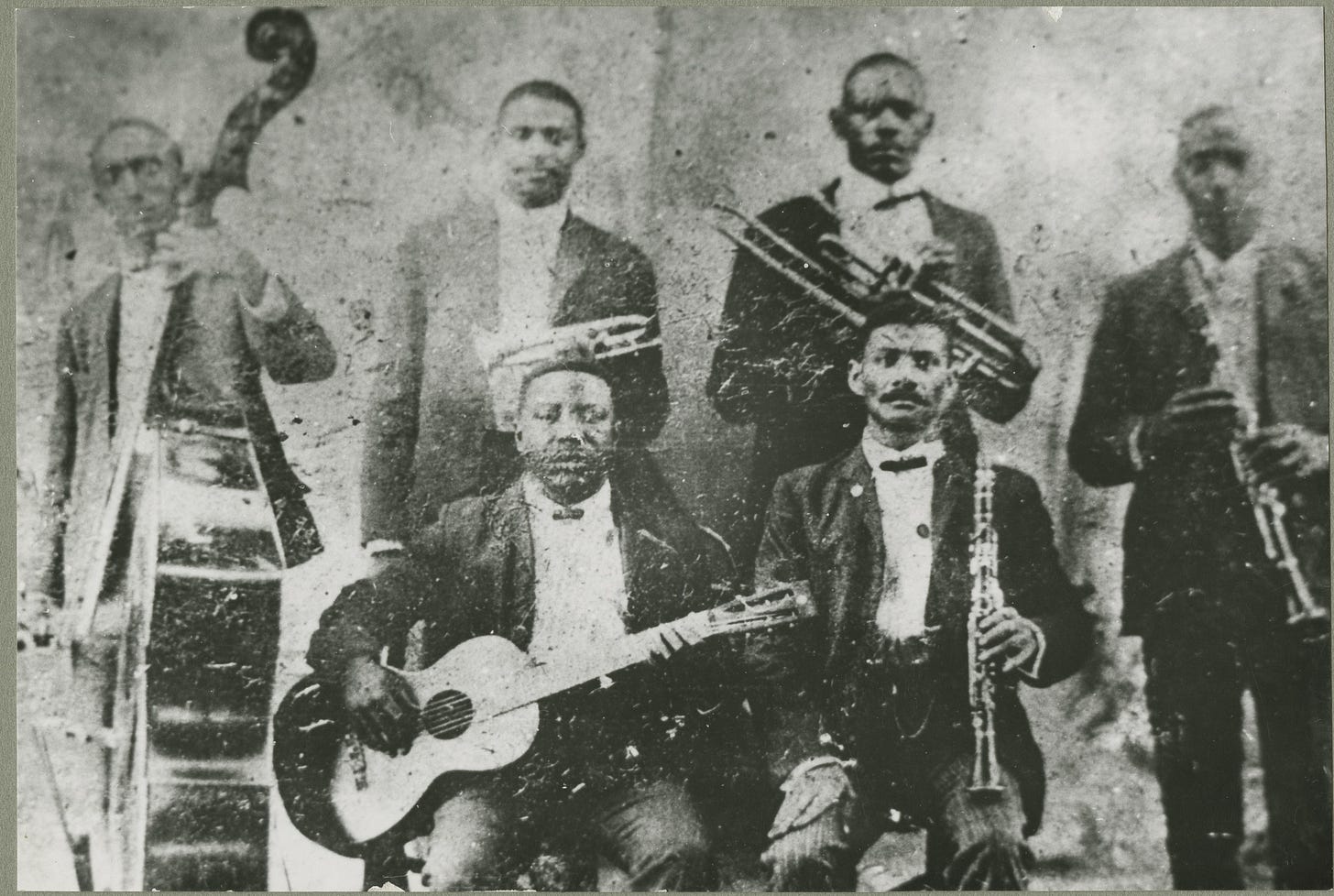 The Bolden Band, Circa 1905. Buddy Bolden (behind the guitarist) was the first musician credited for playing the music later named Jazz.