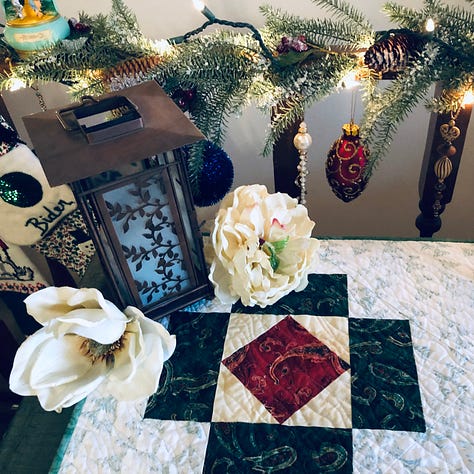 A collection of ornaments and quilted decorations in red, green and sparkling white.