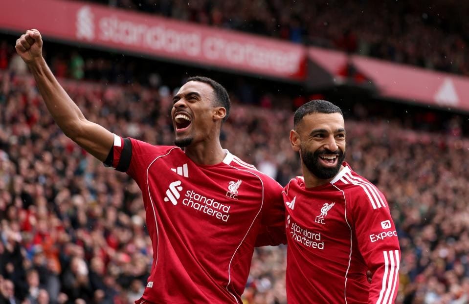Ryan Gravenberch and Mohamed Salah celebrate against Everton