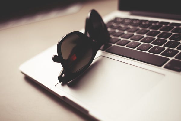 computer and sunglasses computer and sunglasses