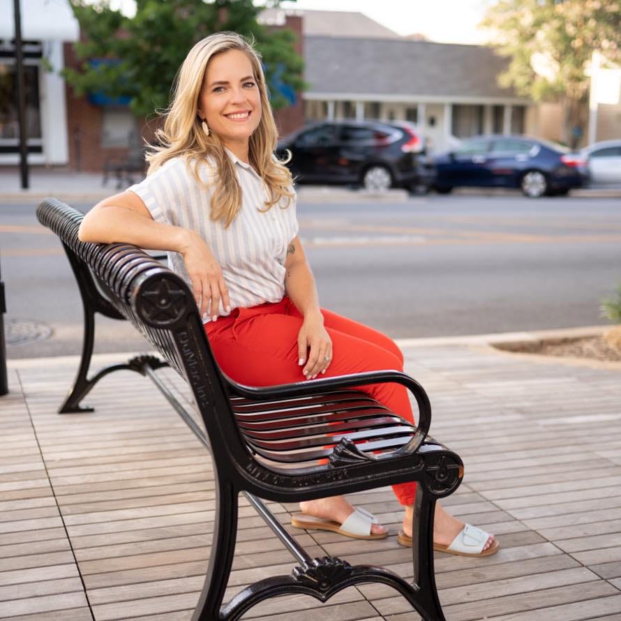 May be an image of 1 person, sitting and outdoors