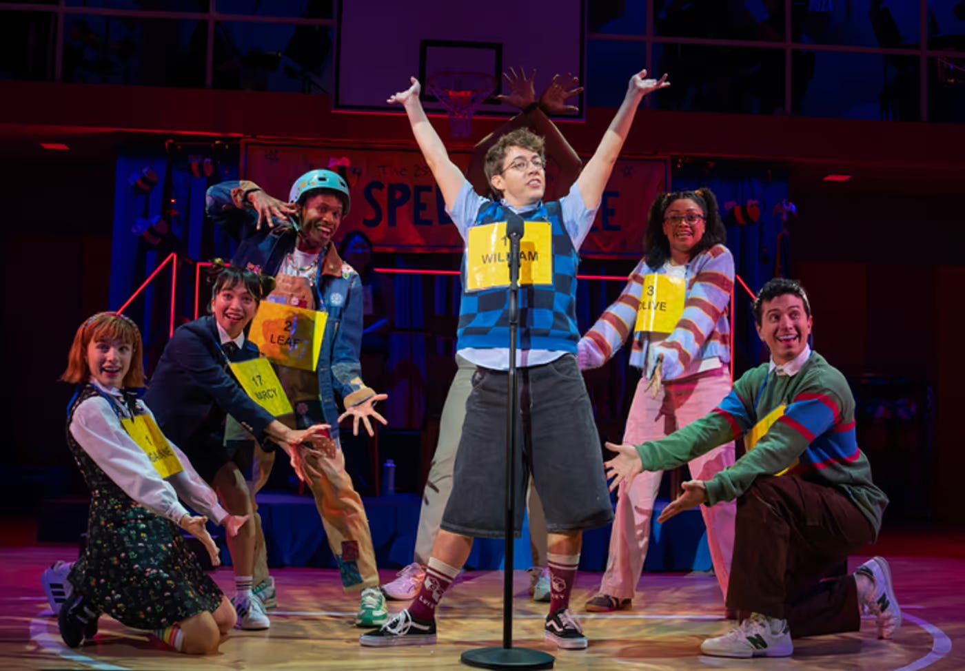 The company of Spelling Bee surrounds Kevin McHale as he sings a song about his character's "magic foot"
