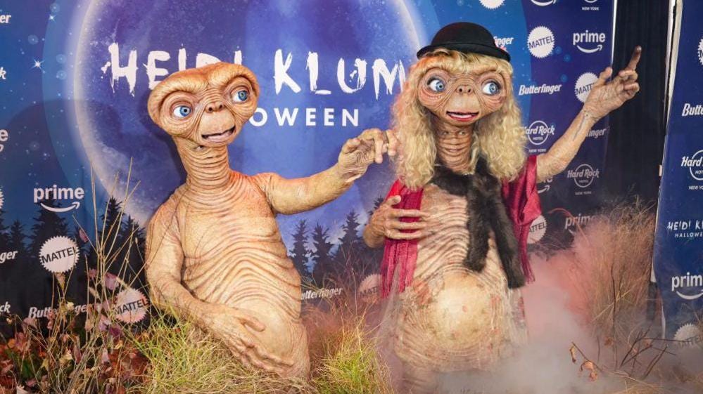 Model Heidi Klum and husband Tom Kaulitz, both dressed as E.T. at Klum's 23rd Annual Halloween Party at the Hard Rock Hotel New York Model Heidi Klum and husband Tom Kaulitz, both dressed as E.T. at Klum's 23rd Annual Halloween Party at the Hard Rock Hotel New York