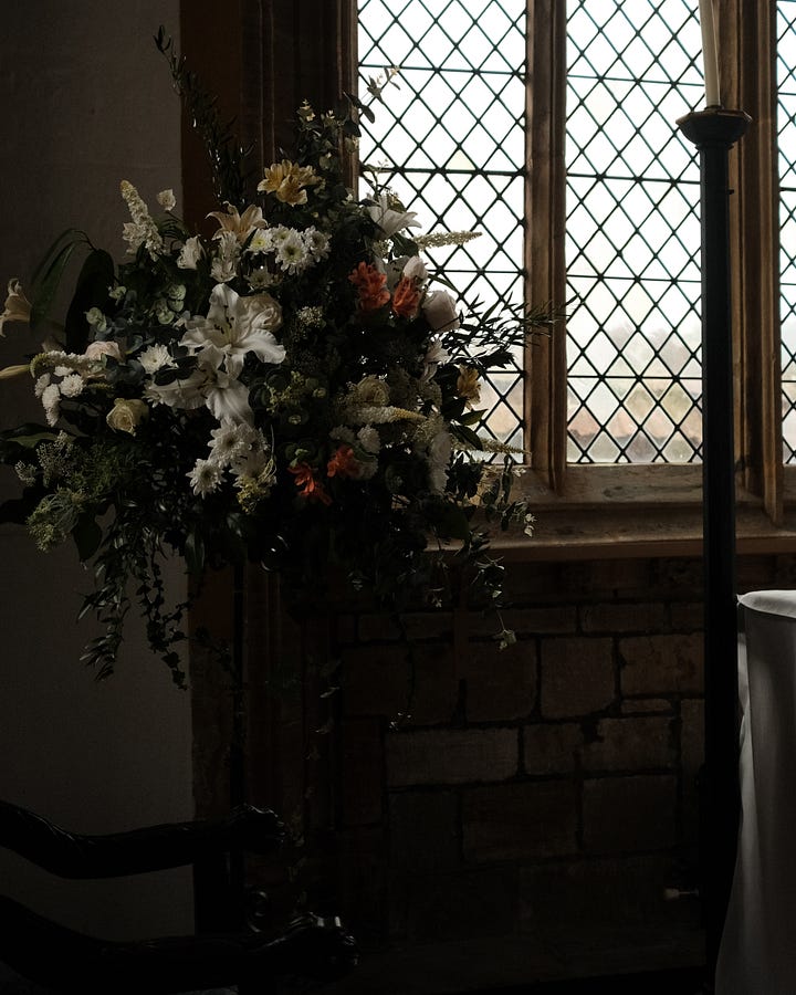 Church flowers and stained glass windows. Praising Shadows / Rebecka Wolfe