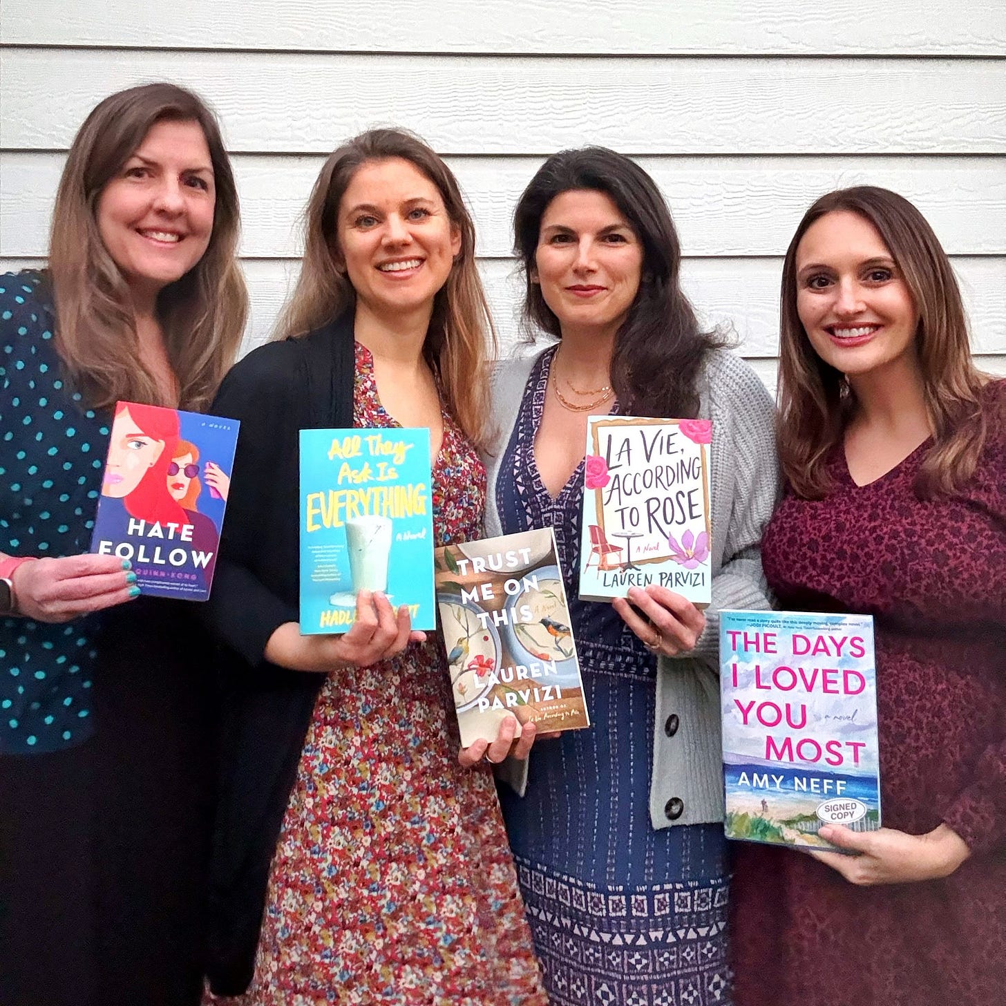 Members of the Writing Group Chat, Erin Quinn-Kong, Hadley Leggett, Lauren Parvizi, and Amy Neff, holding their novels. Members of the Writing Group Chat, Erin Quinn-Kong, Hadley Leggett, Lauren Parvizi, and Amy Neff, holding their novels.