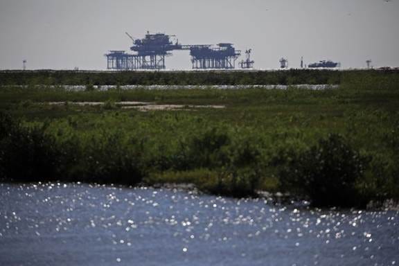 Offshore oil well platforms in the Gulf of Mexico off Port Fourchon, Louisiana, on April 21, 2021.&nbsp;
