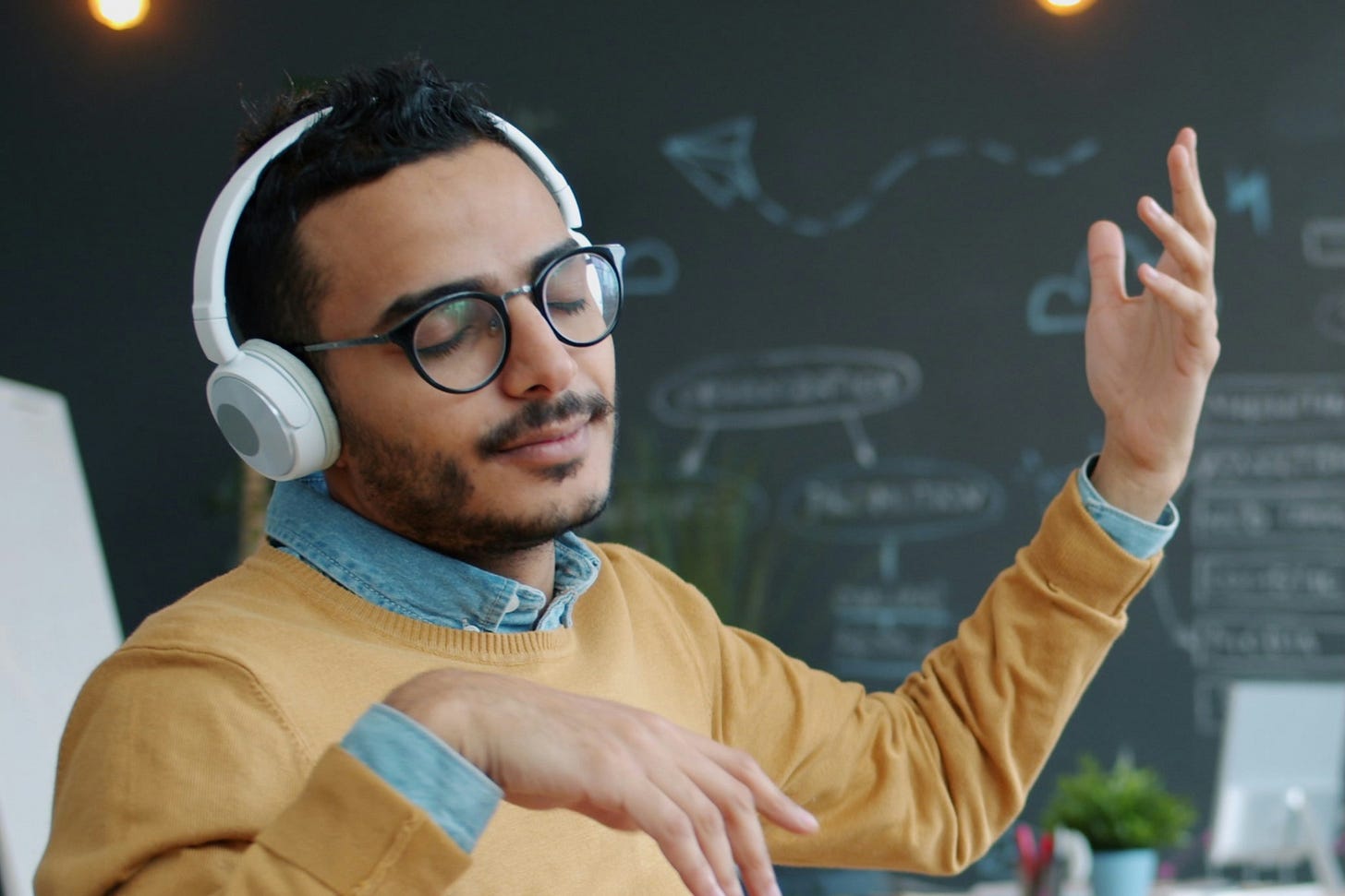 Man listening to headphones with eyes closed. Man listening to headphones with eyes closed.