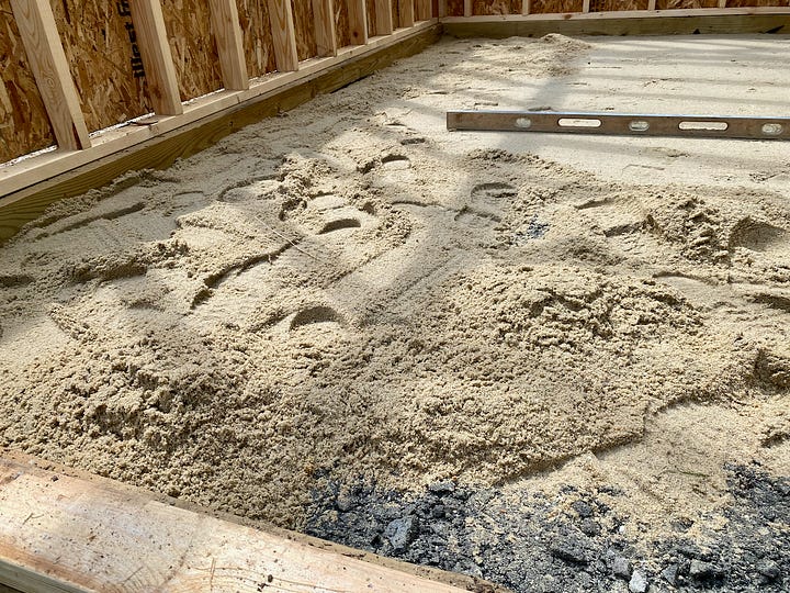 Collage of images showing a brick paver floor being installed.