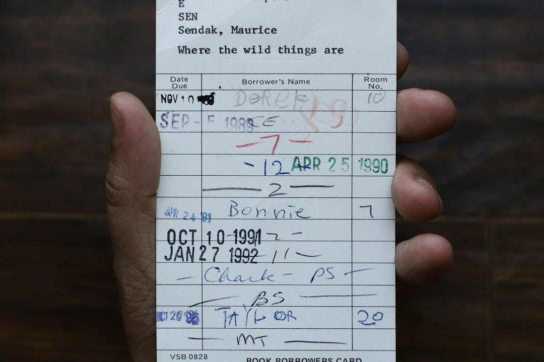 person holding white paper document