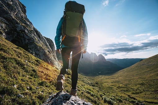 Solo Woman Backpacker Hiking On Alpine Mountain Peak Stock Photo ...