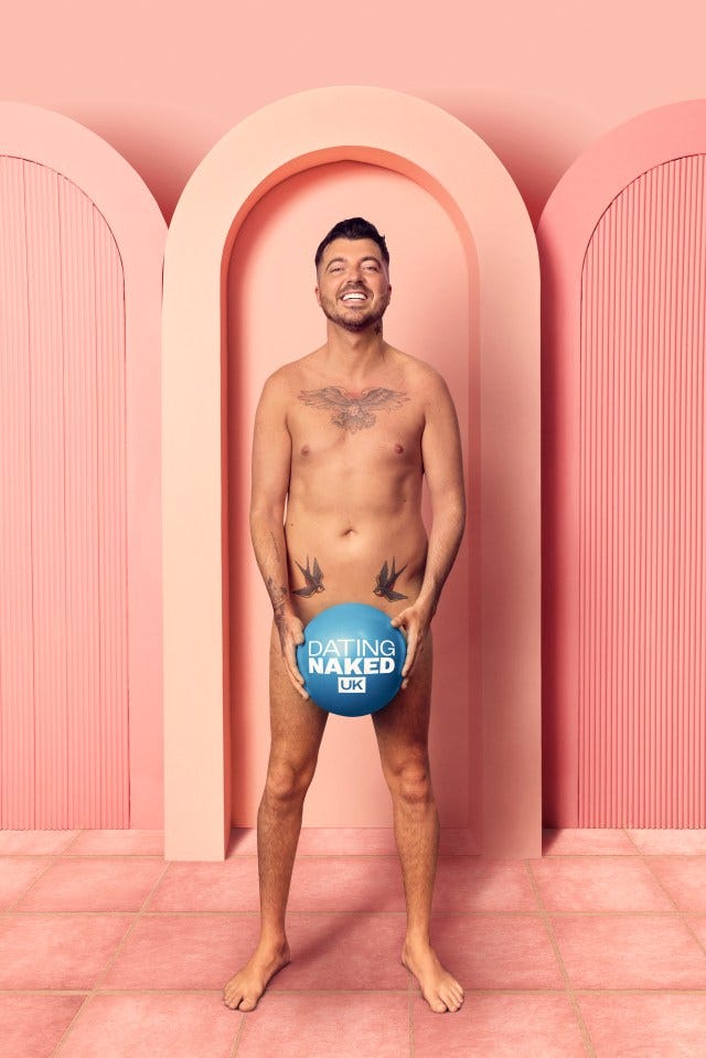 Rylan Clark holding a Dating Naked UK ball.