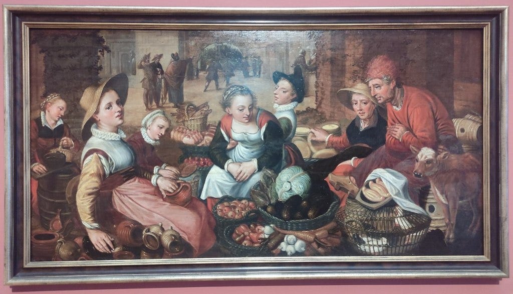 A painting of a market, with goods, sellers and buyers in the forefront. Behind people are milling - presumably some of these are workers about to head to the vineyard. A painting of a market, with goods, sellers and buyers in the forefront. Behind people are milling - presumably some of these are workers about to head to the vineyard.