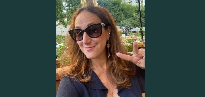 A selfie of Liz in sunglasses