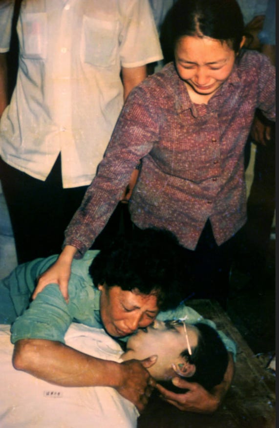 A heart-wrenching image: a mother grieves over her son, shot and killed during the Tiananmen crackdown on June 4, 1989.