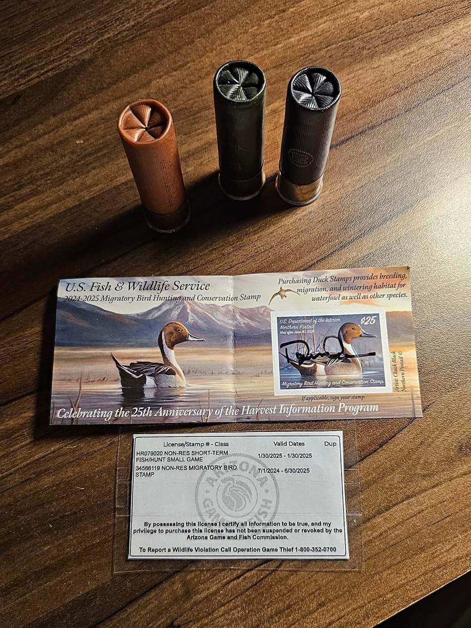 A group of shotgun shells and a pair of stamps

AI-generated content may be incorrect.