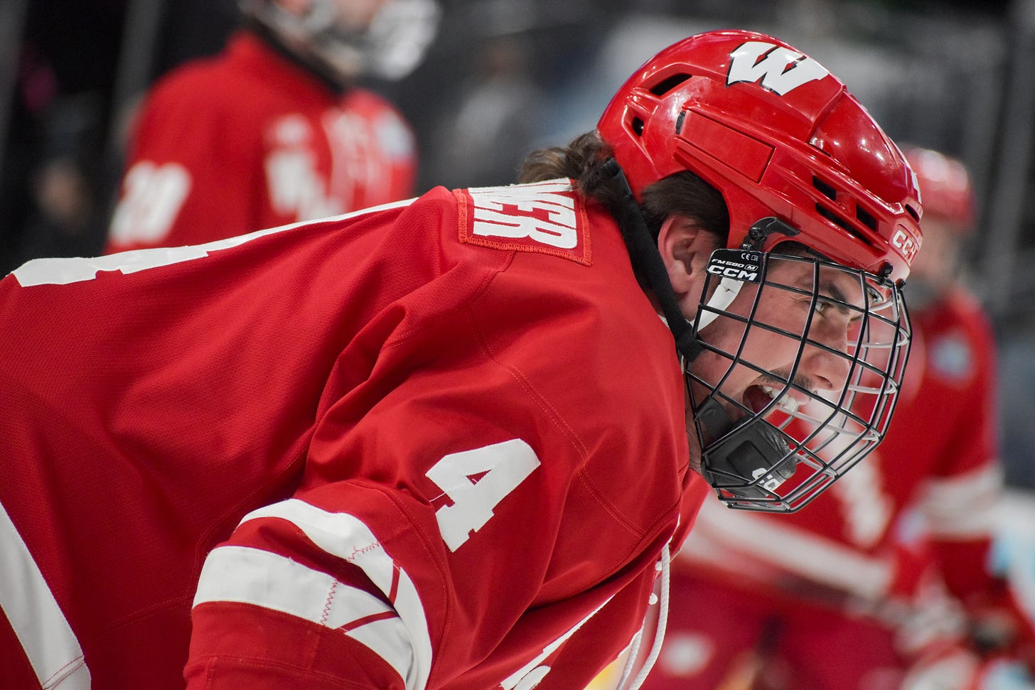 Wisconsin hockey captain Ben Dexheimer shouts during warmups at 2026 NCAA Mens Frozen Four. Wisconsin hockey captain Ben Dexheimer shouts during warmups at 2026 NCAA Mens Frozen Four.