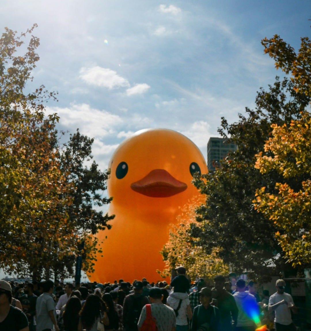 a large rubber ducky floating in the air a large rubber ducky floating in the air