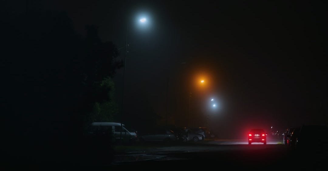 a couple of cars that are sitting in the street