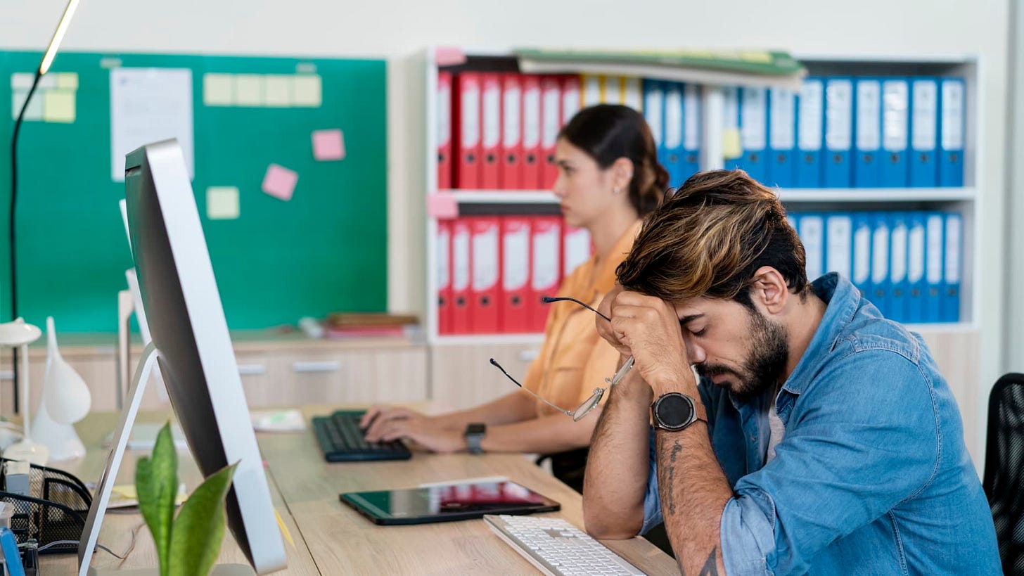 Tired man with closed eyes sitting at his desk Tired man with closed eyes sitting at his desk