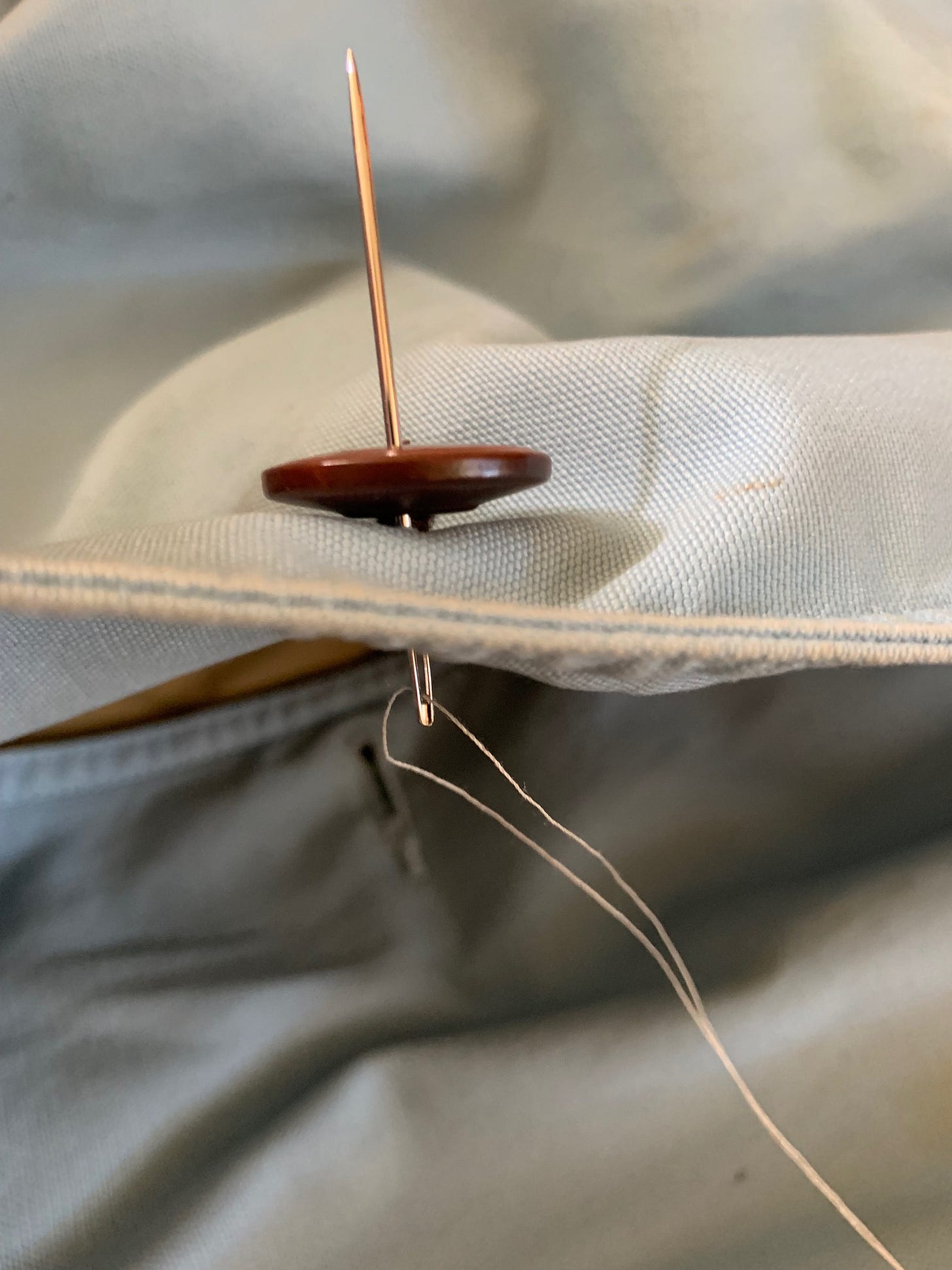 needle through button eye