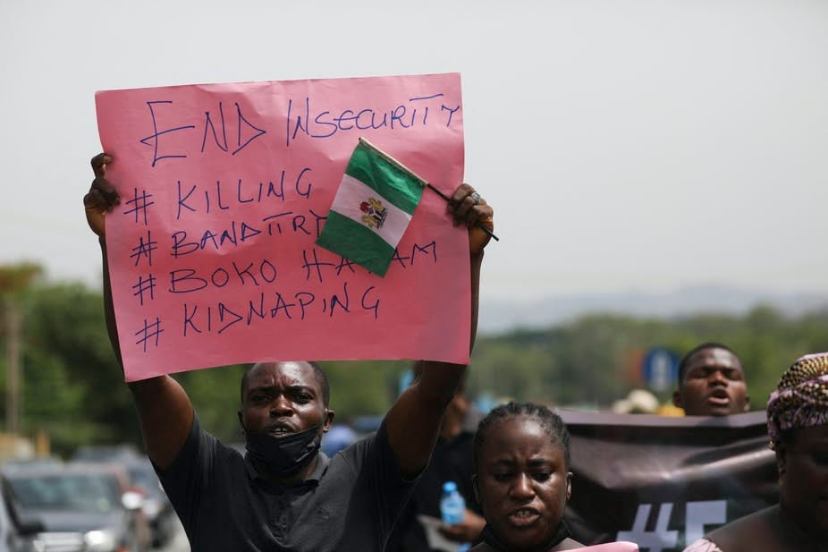 A man holding a placard in protest A man holding a placard in protest