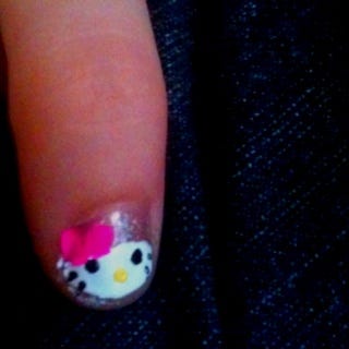 My version of the hello kitty nail I saw on here. Not too bad for my first  try. My 4 year old niece is loving it!!