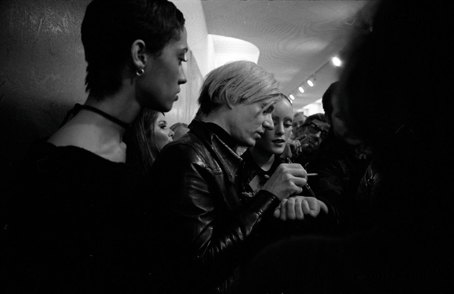 Andy Warhol signing autographs