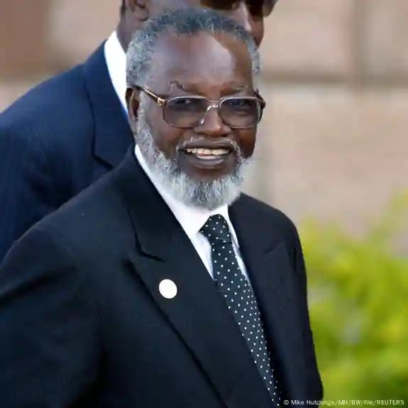 Nujoma wears glasses and a tie as he smiles into the camera in this photo from 2004 Nujoma wears glasses and a tie as he smiles into the camera in this photo from 2004