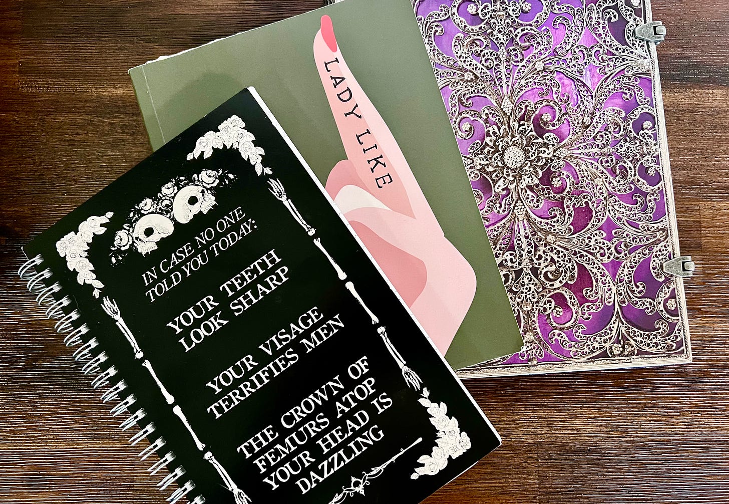 a pile of three notebooks