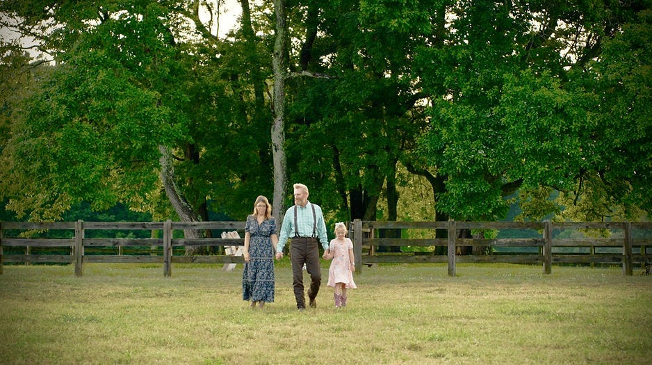 Rory Feek and Rebecca Lamb with Indiana Feek walking in the back field at Hardison Mill Farm Rory Feek and Rebecca Lamb with Indiana Feek walking in the back field at Hardison Mill Farm