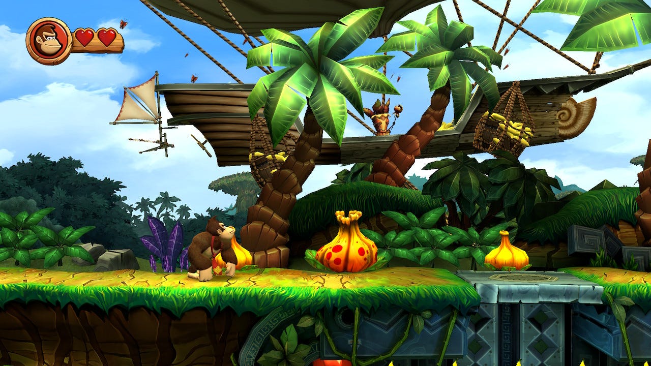Donkey Kong looks at an airship fly by in the jungle.