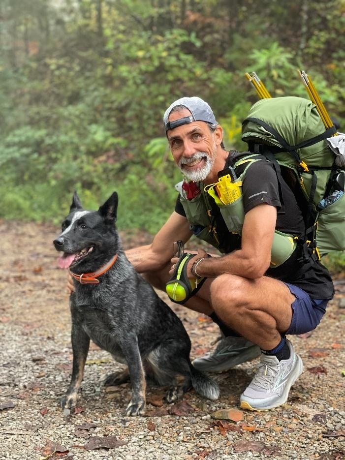 A person kneeling next to a dog

AI-generated content may be incorrect.