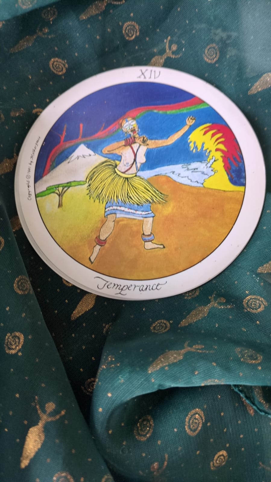 The Temperance card - a round image of a dancer wearing peculiar tribal clothing The Temperance card - a round image of a dancer wearing peculiar tribal clothing