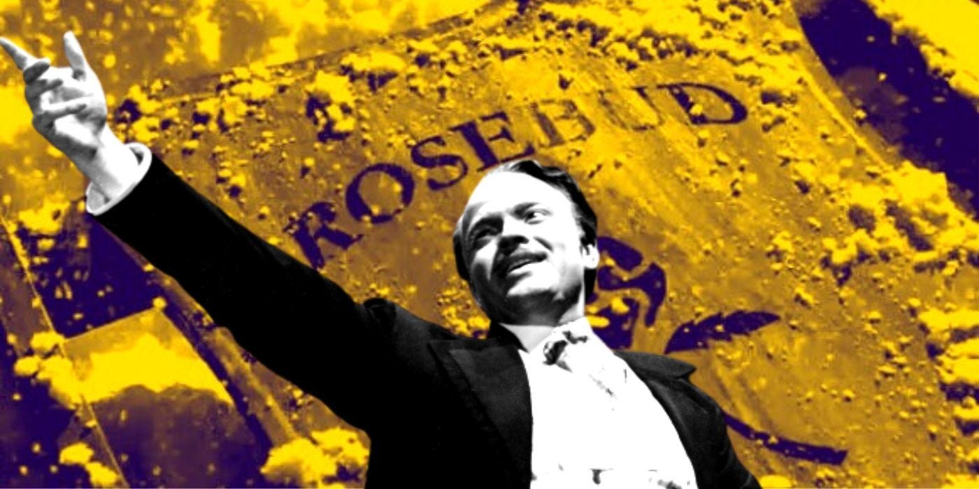 Kane raising a hand while Rosebud burns in the background in Citizen Kane