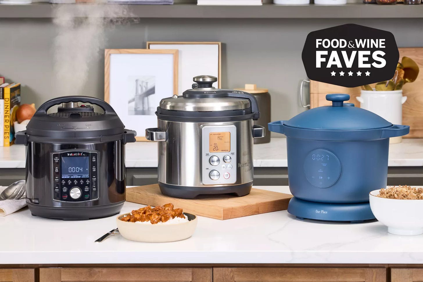 Three pressure cookers on a kitchen counter, one releasing steam