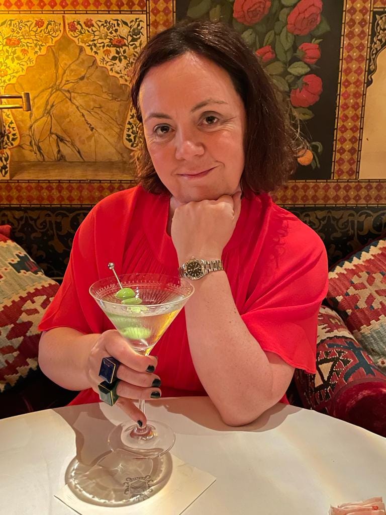 Image By Author - Woman Holds Martini